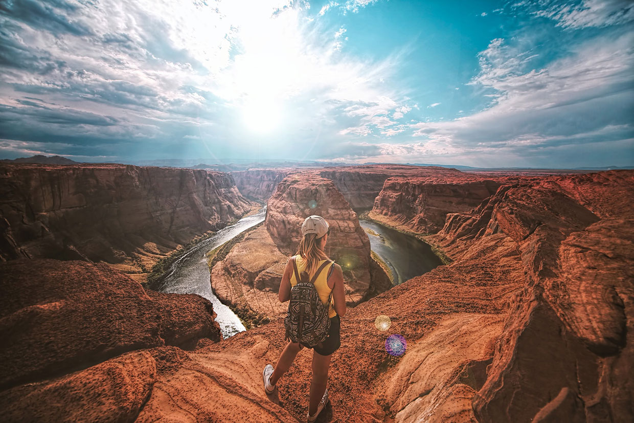 Woman standing on top of canyon